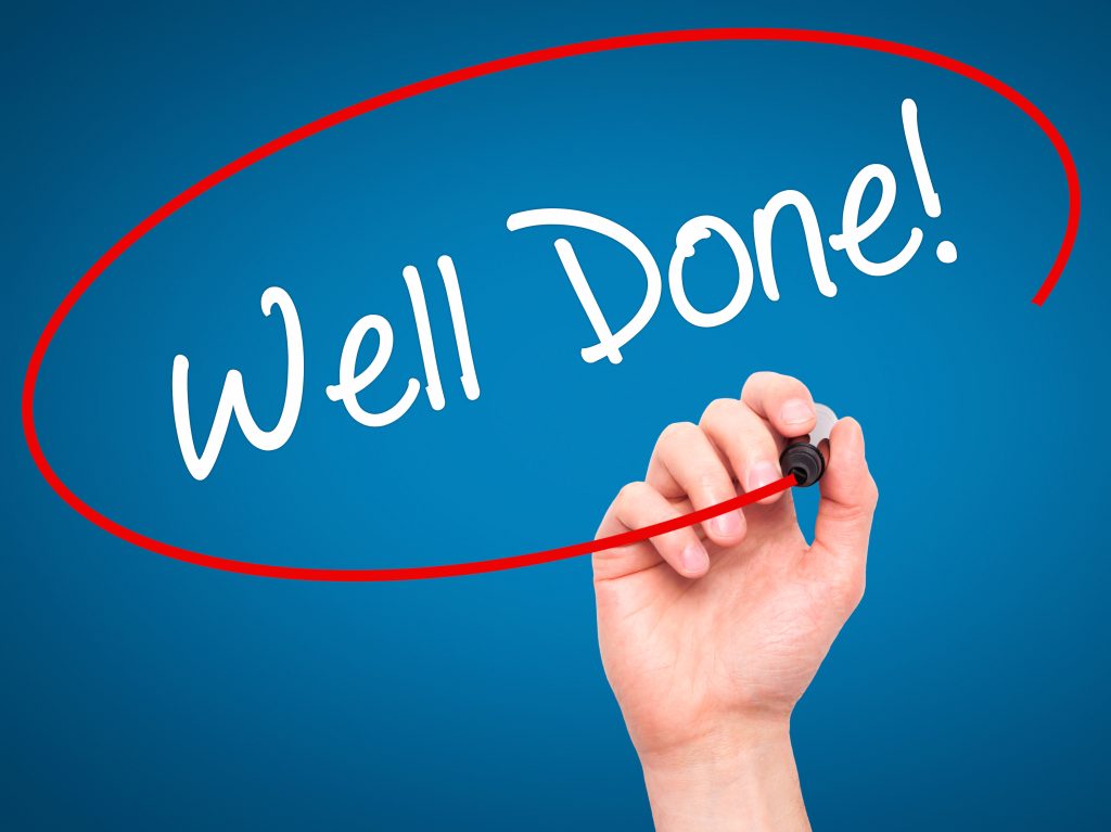 bigstock-Man-Hand-writing-Well-Done-wi-99860177